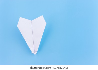 Plane Crash Concept. Paper Plane Upside Down On Blue Background