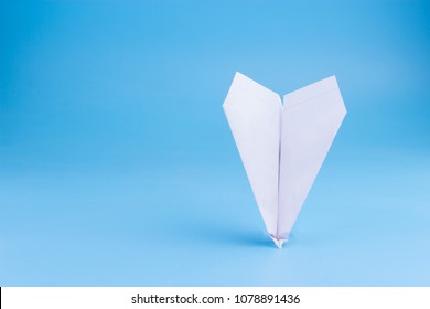 Plane Crash Concept. Paper Plane Upside Down On Blue Background