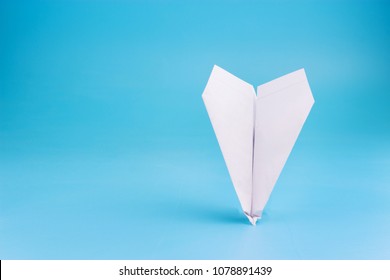 Plane Crash Concept. Paper Plane Upside Down On Blue Background