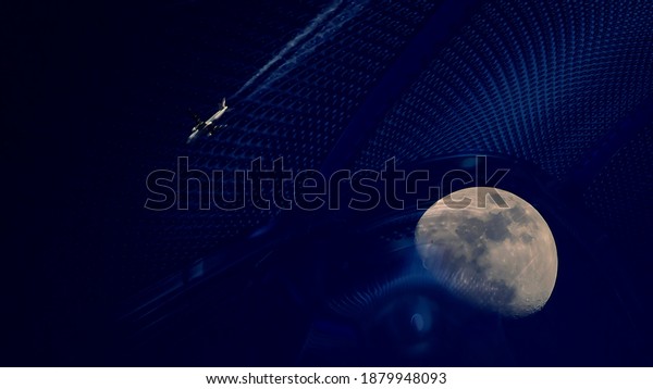 The plane flies over the moon in the dark blue\
sky against the background of an abstract design of mysterious\
origin.