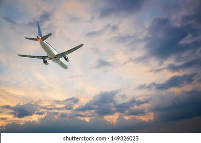 Plane Flying Away Against The Sky