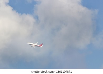The plane is flying in the clouds, copy space for design