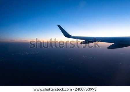 The plane is flying in the sky