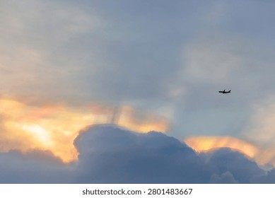 The plane is flying through the clouds.