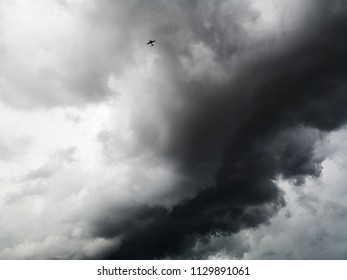 Plane flying through cloudy.