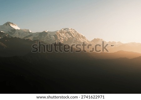 Plane flys by the panoramic Himalayan Mountains in Nepal - Travel and Landscape