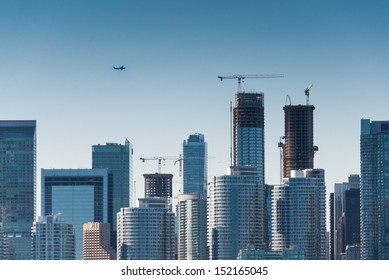 Plane flys over the city (Building signs are removed)