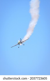 Plane Helicopter Across The Sky Flying Smoke Trail