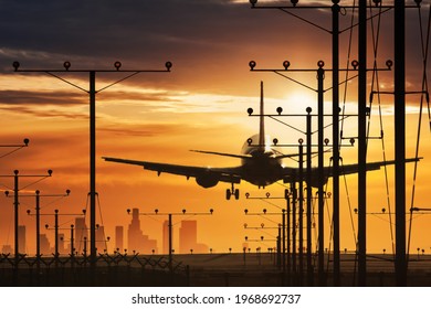 Plane Landing In LAX Airport At Sunset. Los Angeles, California