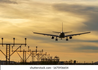 Plane Landing On The Runway Of  Airport