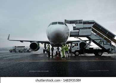 A Plane Landing On The Wet Runway At Adisucipto Airport On Wet Season, December 2018