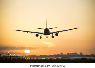 Plane Landing When Sunrise Started.