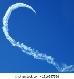 Plane making a looping in an empty blue sky