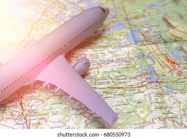 Plane on the map. Traveling abroad, international flights, flight, airlines. In the rays of sunset - Shutterstock ID 680550973