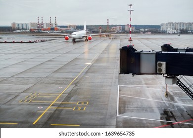 The Plane Is On The Runway At Domodedovo Airport . Cloudy Weather, Grey Sky, Non-flying Weather. Cancellation Of The Plane's Flight.