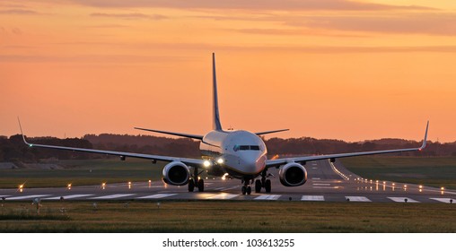 Plane On The Tarmac At Sunset