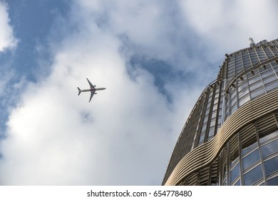 plane over skyscraper