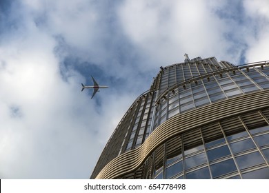 plane over skyscraper