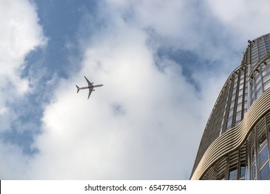 plane over skyscraper
