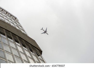 plane over skyscraper
