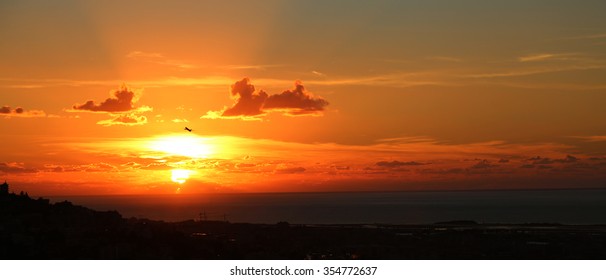 Plane over sunset
