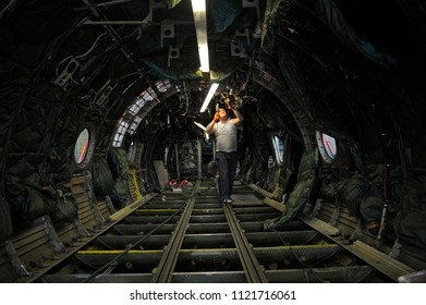 Plane Overhauling. Electrician Installing New Electrical Wiring Inside Of A Body Plane. Press-tour To The State Aircraft Repair Plant “410”. June 7, 2018. Kiev, Ukraine