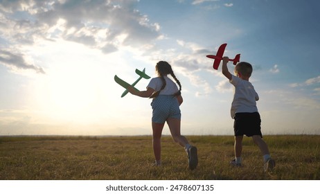 Plane is running through a forest with children in their childhood. Airplane toy field concept. plane parked next to crowd of children running. fun Child runs past plane parked park and runs around. - Powered by Shutterstock