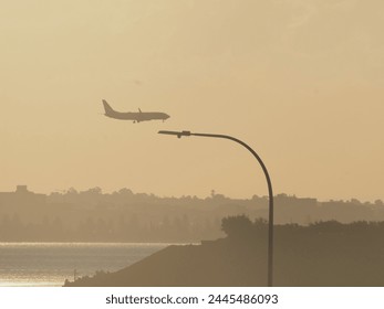 a plane in a selective focus during sunset 