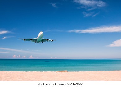 Airplane Landing Above Beach Stock Photo (Edit Now) 416760664