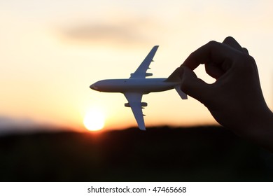 Plane At Sunset