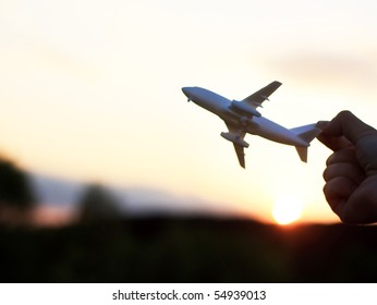 Plane At Sunset