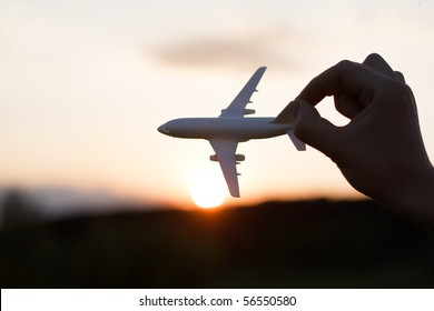 Plane At Sunset