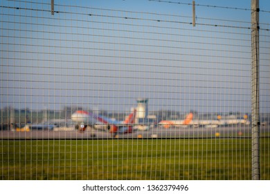 Plane Take Off Behind Airport Security Fence