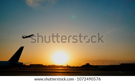 Plane taking off sky sunset sun dusk in airport China.
