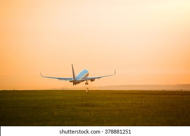 Plane Taking Off Sunset