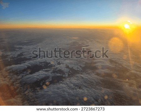 plane view of the couds in the sunset light