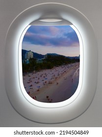 Plane Window Aerial View Of A Patong Pa Tong Beach At Sunset Phuket Thailand