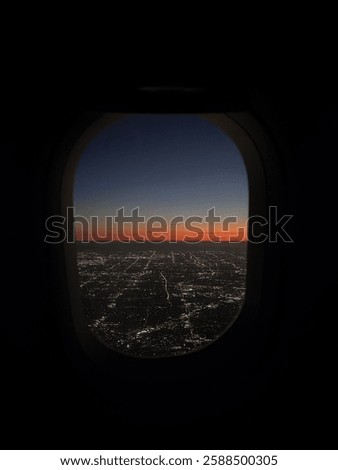 plane window with sunset and sky view 