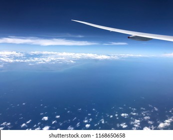 plane wing and cloud