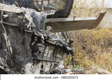 Plane wreckage, parts of the fuselage and tail of the burned and broken aircraft at the dump of non-ferrous scrap metal for recycling.