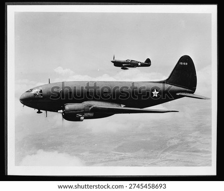 Planes in flight. The ship in the foreground is a C-46 transport, originally designed as a commercial plane to carry a crew of five men and thirty-six passengers. Vintage black and white photography.