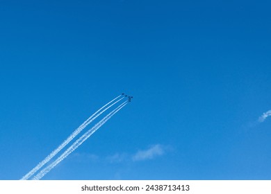 Planes flying in formation as part of an Aerobatic airshow  - Powered by Shutterstock