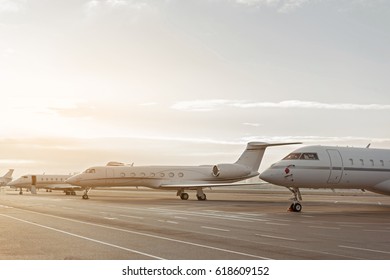 Planes Situating At Landing Strip Before Flight