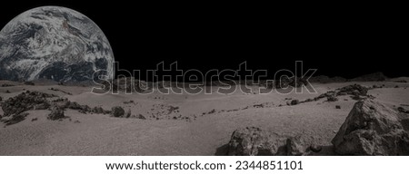 Planet with arid landscape, rocky hills and mountains and a giant planet at the horizon, for space exploration and science fiction backgrounds. Elements of this image furnished by NASA