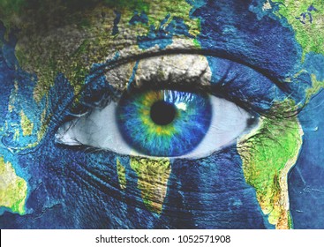 Planet earth and blue human eye
