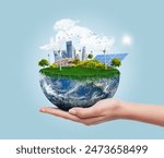 Planet earth with clean modern city relying on renewable resources. Environmental concept of alternative sustainable energy for an eco-friendly planet. Planet earth used with permission from NASA.