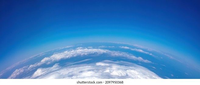 Planet Earth Curvature. Aerial Shot. Blue Cloudy Sky Over Land. Space, Science Concept