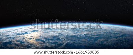 Planet Earth in dark outer space. Civilization. Wide horizontally image. Elements of this image furnished by NASA