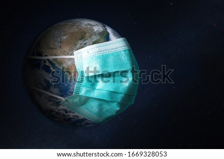 Planet Earth with face mask protect. World medical concept. Elements of this image furnished by NASA.