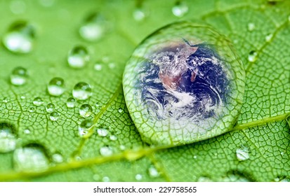 Planet Earth Inside A Raindrop Closeup On A Green Leaf (Elements Of This Image Furnished By NASA ) Soft Focus